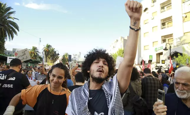 Tunisian take part in a protest against President Kais Saied ahead of the upcoming presidential elections, Friday, Sept. 13, 2024, on Avenue Habib Bourguiba in the capital Tunis.(AP Photo/Anis Mili)