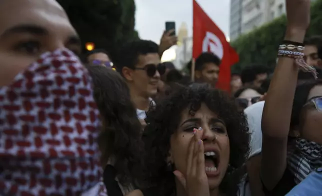 Tunisian take part in a protest against President Kais Saied ahead of the upcoming presidential elections, Friday, Sept. 13, 2024, on Avenue Habib Bourguiba in the capital Tunis. (AP Photo/Anis Mili)