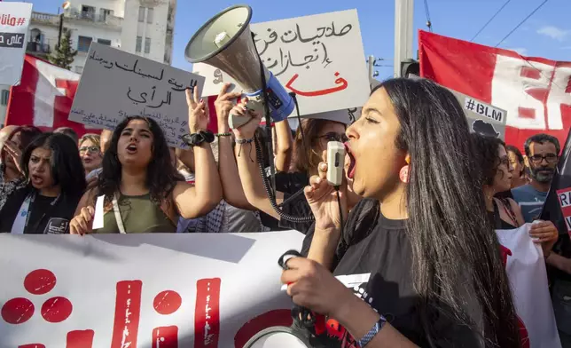 Tunisian take part in a protest against President Kais Saied ahead of the upcoming presidential elections, Friday, Sept. 13, 2024, on Avenue Habib Bourguiba in the capital Tunis. (AP Photo/Anis Mili)