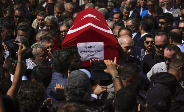 People attend the funeral prayers for Aysenur Ezgi Eygi, 26 year-old Turkish-American activist killed by the Israeli military, outside the central mosque of City of Didim, Turkey, Saturday, Sept. 14, 2024. (AP Photo/Khalil Hamra)