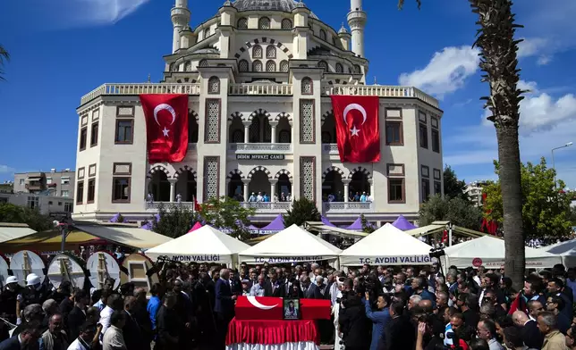 People attend the funeral prayers for Aysenur Ezgi Eygi, 26 year-old Turkish-American activist killed by the Israeli military, outside the central mosque of City of Didim, Turkey, Saturday, Sept. 14, 2024. (AP Photo/Khalil Hamra)