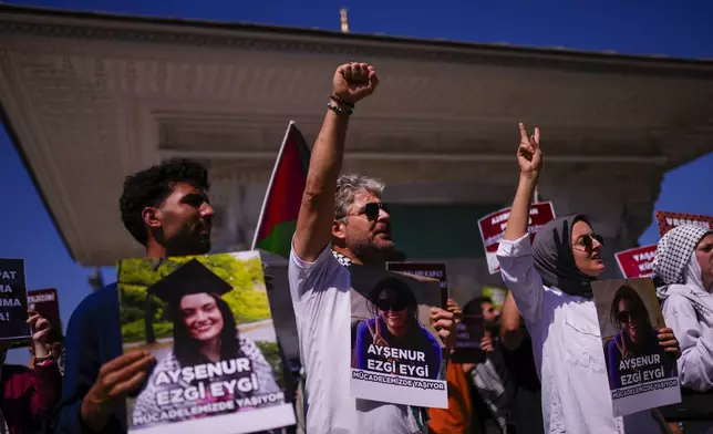 People hold photographs of Aysenur Ezgi Eygi, 26 year-old Turkish-American activist killed by the Israeli military, as they shout slogans during a protest in her memory in Istanbul, Turkey, Saturday, Sept. 14, 2024. (AP Photo/Francisco Seco)