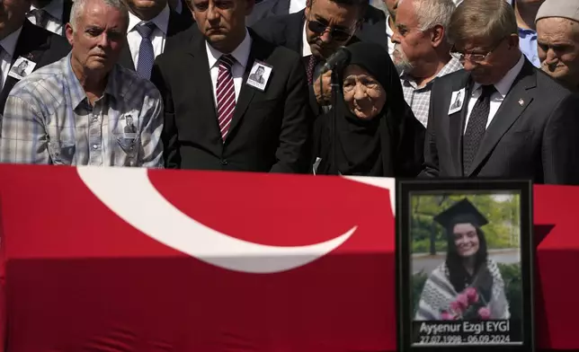 Mehmet, the father of Aysenur Ezgi Eygi, a 26 year-old Turkish-American activist killed by the Israeli military, left, attends prayers during his daughter's funeral outside the central mosque of Didim, Turkey, Saturday, Sept. 14, 2024,(AP Photo/Khalil Hamra)