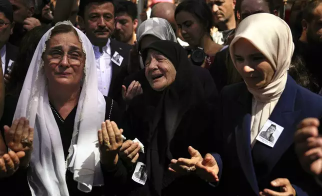 Relatives mourn the death of Aysenur Ezgi Eygi, a 26 year-old Turkish-American activist killed by the Israeli military, during her funeral in Didim, Turkey, Saturday, Sept. 14, 2024,(AP Photo/Khalil Hamra)