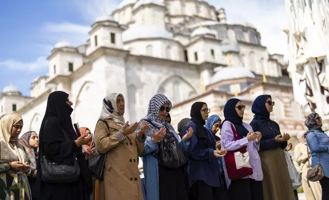 Women attend a funeral prayer in abstentia ceremony in memory of Turkish-American activist Aysenur Ezgi Eygi killed by Israeli gunfire, at Fatih mosque in Istanbul, Turkey, Friday, Sept. 13, 2024. (AP Photo/Francisco Seco)