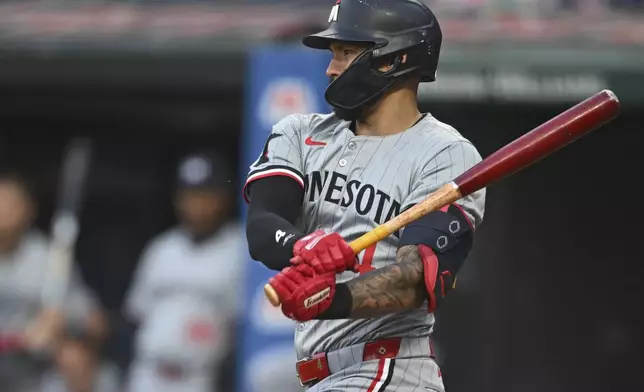 Minnesota Twins' Carlos Correa hits into a fielders choice during the first inning of a baseball game against the Cleveland Guardians, Wednesday, Sept. 18, 2024, in Cleveland. (AP Photo/David Dermer)