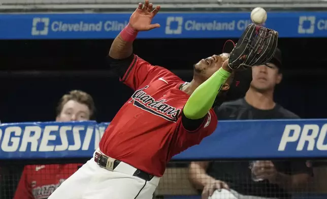 Cleveland Guardians third baseman Jose Ramirez catches a foul ball for an out against Minnesota Twins' Carlos Santana in the fourth inning of a baseball game Monday, Sept. 16, 2024, in Cleveland. (AP Photo/Sue Ogrocki)