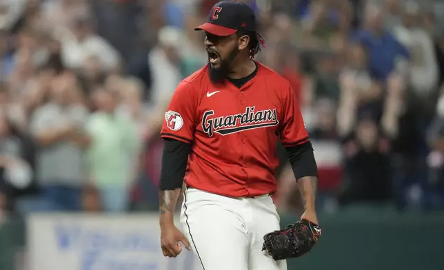 Cleveland Guardians relief pitcher Emmanuel Clase reacts after his teams defeated the Minnesota Twins in a baseball game Monday, Sept. 16, 2024, in Cleveland. (AP Photo/Sue Ogrocki)