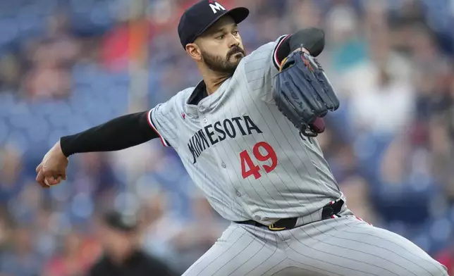 Minnesota Twins' Pablo Lopez pitches in the first inning of a baseball game against the Cleveland Guardians, Monday, Sept. 16, 2024, in Cleveland. (AP Photo/Sue Ogrocki)