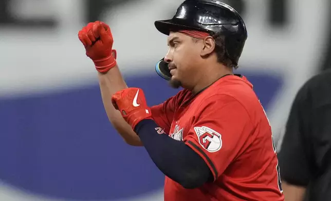 Cleveland Guardians' Josh Naylor gestures from second base after hitting a double in the eighth inning of a baseball game against the Minnesota Twins, Monday, Sept. 16, 2024, in Cleveland. (AP Photo/Sue Ogrocki)