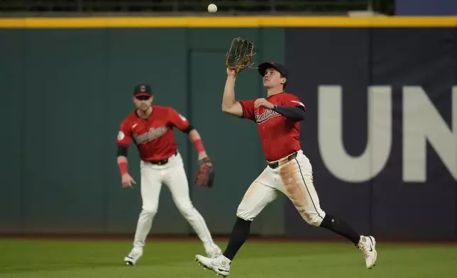 Cleveland Guardians right fielder Will Brennan catches a fly ball for an out against Minnesota Twins' Will Castro in the fourth inning of a baseball game Monday, Sept. 16, 2024, in Cleveland. (AP Photo/Sue Ogrocki)