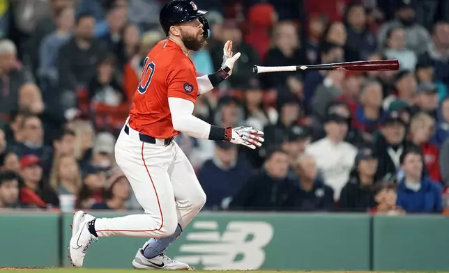 Boston Red Sox's Trevor Story watches his RBI single during the fourth inning of a baseball game against the Minnesota Twins, Friday, Sept. 20, 2024, in Boston. (AP Photo/Michael Dwyer)