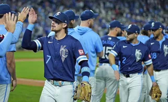 Kansas City Royals shortstop Bobby Witt Jr. celebrates with teammates after their baseball game against the Minnesota Twins, Friday, Sept. 6, 2024, in Kansas City, Mo. The Royals won 5-0. (AP Photo/Charlie Riedel)