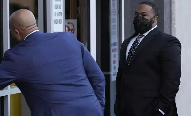 Former Memphis police officer Demetrius Haley, right, arrives at the federal courthouse before the start of jury selection of the trial in the Tyre Nichols case Monday, Sept. 9, 2024, in Memphis. (AP Photo/George Walker IV)