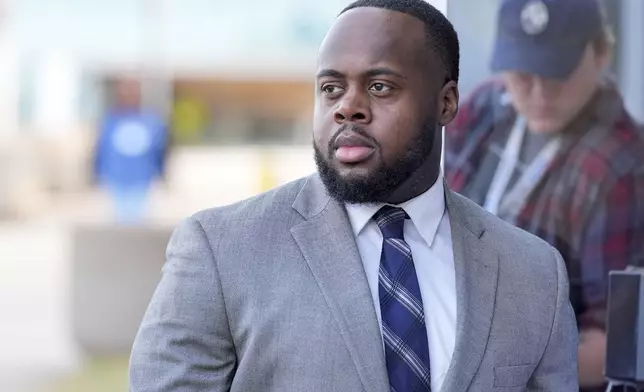 Former Memphis police officer Tadarrius Bean arrives at the federal courthouse for the second day of jury selection for the trial in the Tyre Nichols case Tuesday, Sept. 10, 2024, in Memphis, Tenn. (AP Photo/George Walker IV)