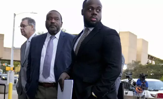 Former Memphis police officer Tadarrius Bean, right, arrives at the federal courthouse before the start of jury selection of the trial in the Tyre Nichols case Monday, Sept. 9, 2024, in Memphis. (AP Photo/George Walker IV)