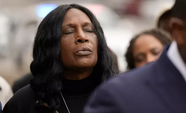 RowVaughn Wells, mother of Tyre Nichols, closes her eyes during a prayer vigil outside the federal courthouse during the trial of three former Memphis police officers accused of killing her son Wednesday, Sept. 25, 2024, in Memphis, Tenn. (AP Photo/George Walker IV)