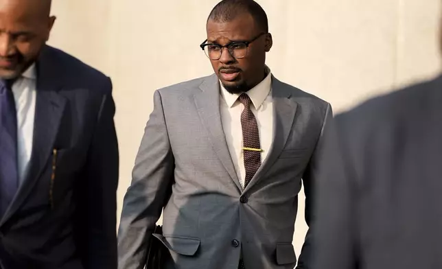 Former Memphis police officer Justin Smith leaves the federal courthouse after the first day of jury selection of the trial in the Tyre Nichols case Monday, Sept. 9, 2024, in Memphis, Tenn. (AP Photo/George Walker IV)