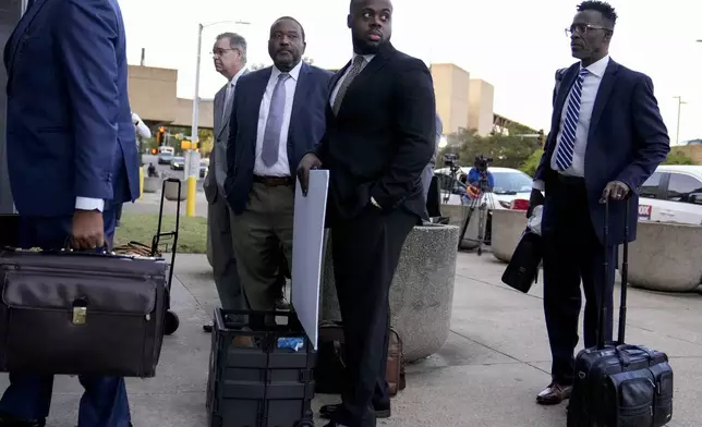 Former Memphis police officer Tadarrius Bean, second from right, arrives at the federal courthouse before the start of jury selection of the trial in the Tyre Nichols case Monday, Sept. 9, 2024, in Memphis. (AP Photo/George Walker IV)