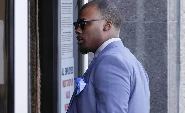 Former Memphis police officer Justin Smith arrives at the federal courthouse for the second day of jury selection for the trial in the Tyre Nichols case Tuesday, Sept. 10, 2024, in Memphis, Tenn. (AP Photo/George Walker IV)