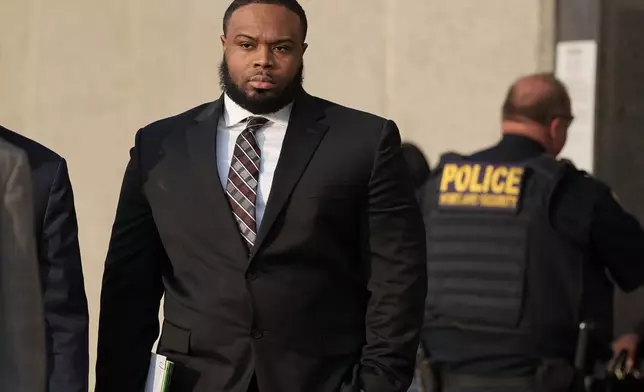 Former Memphis police officer Demetrius Haley leaves the federal courthouse after the first day of jury selection of the trial in the Tyre Nichols case Monday, Sept. 9, 2024, in Memphis, Tenn. (AP Photo/George Walker IV)