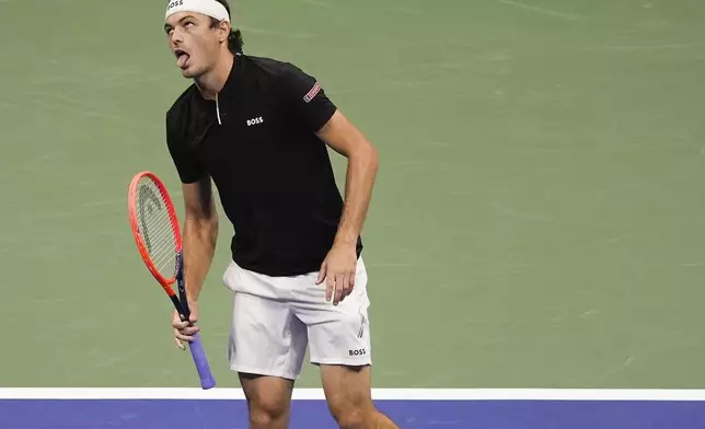 Taylor Fritz, of the United States, reacts in the first set against Frances Tiafoe, of the United States, during the men's singles semifinal of the U.S. Open tennis championships, Friday, Sept. 6, 2024, in New York. (AP Photo/Julia Nikhinson)