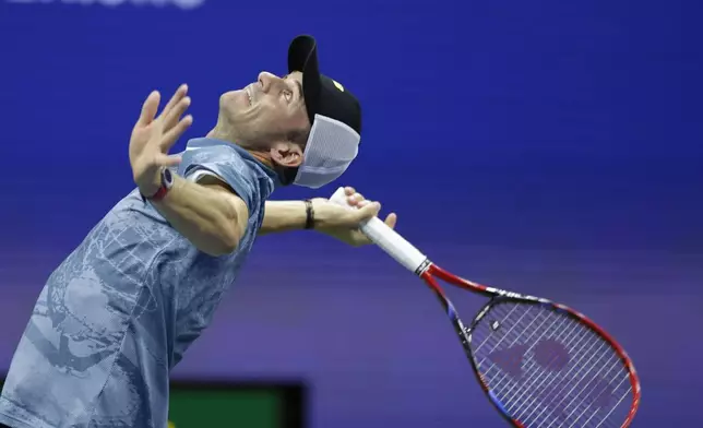 Tommy Paul, of the United States, serves to Jannik Sinner, of Italy, during a fourth round match of the U.S. Open tennis championships, Monday, Sept. 2, 2024, in New York. (AP Photo/Adam Hunger)