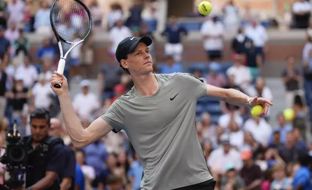 Jannik Sinner, of Italy, hits autographed balls into the crowd after defeating Christopher O'Connell, of Australia, during the third round of the U.S. Open tennis championships, Saturday, Aug. 31, 2024, in New York. (AP Photo/Julia Nikhinson)