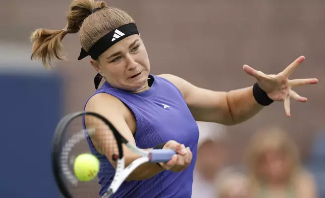 Karolina Muchova, of the Czech Republic, returns a shot to Anastasia Potapova, of Russia, during the third round of the U.S. Open tennis championships, Saturday, Aug. 31, 2024, in New York. (AP Photo/Adam Huger)