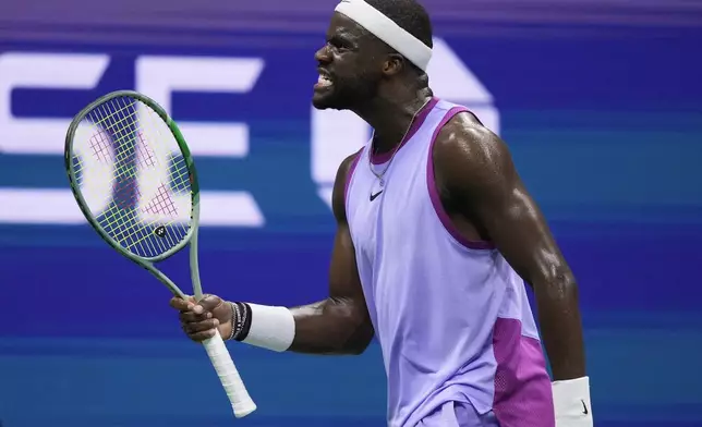 Frances Tiafoe, of the United States, reacts after scoring a point against Taylor Fritz, of the United States, during the men's singles semifinal of the U.S. Open tennis championships, Friday, Sept. 6, 2024, in New York. (AP Photo/Frank Franklin II)