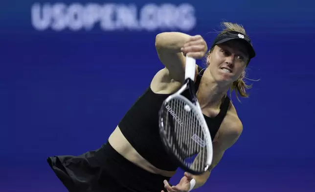 Liudmila Samsonova, of Russia, serves to Iga Swiatek, of Poland, during a fourth round match of the U.S. Open tennis championships, Monday, Sept. 2, 2024, in New York. (AP Photo/Adam Hunger)