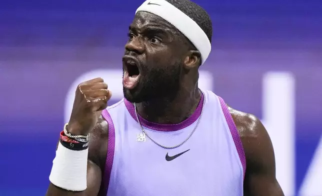 Frances Tiafoe, of the United States, reacts after scoring a point against Taylor Fritz, of the United States, during the men's singles semifinal of the U.S. Open tennis championships, Friday, Sept. 6, 2024, in New York. (AP Photo/Frank Franklin II)