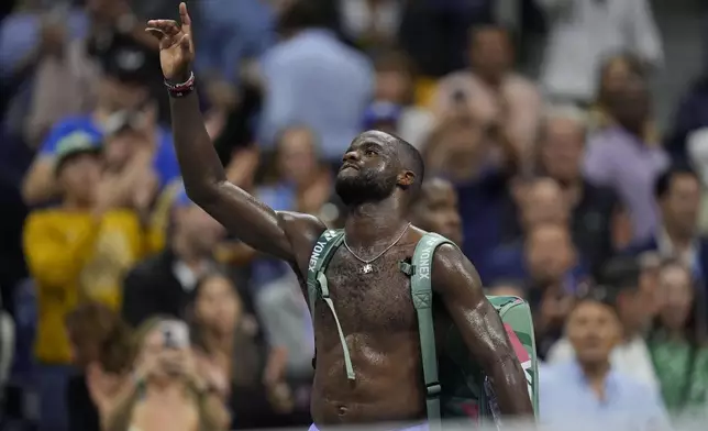 Frances Tiafoe, of the United States, waves to fans after being defeated by Taylor Fritz, of the United States, during the men's singles semifinals of the U.S. Open tennis championships, Friday, Sept. 6, 2024, in New York. (AP Photo/Seth Wenig)