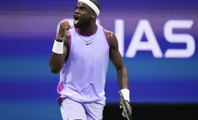 Frances Tiafoe, of the United States, reacts after scoring a point against Taylor Fritz, of the United States, during the men's singles semifinal of the U.S. Open tennis championships, Friday, Sept. 6, 2024, in New York. (AP Photo/Frank Franklin II)