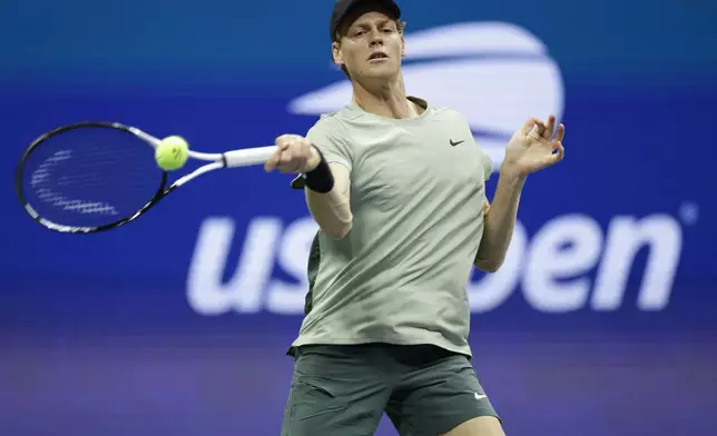 Jannik Sinner, of Italy, returns a shot to Tommy Paul, of the United States, during a fourth round match of the U.S. Open tennis championships, Monday, Sept. 2, 2024, in New York. (AP Photo/Adam Hunger)