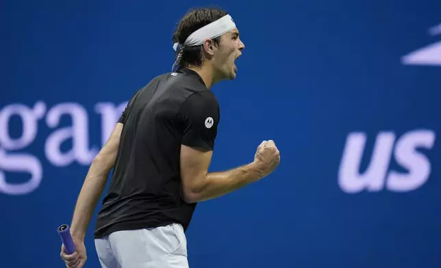 Taylor Fritz, of the United States, reacts against Frances Tiafoe, of the United States, during the men's singles semifinals of the U.S. Open tennis championships, Friday, Sept. 6, 2024, in New York. (AP Photo/Seth Wenig)