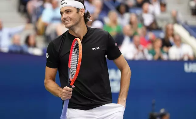 Taylor Fritz, of the United States, reacts in the second set against Jannik Sinner, of Italy, during the men's singles final of the U.S. Open tennis championships, Sunday, Sept. 8, 2024, in New York. (AP Photo/Kirsty Wigglesworth)