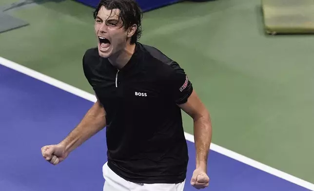 Taylor Fritz, of the United States, reacts after defeating Frances Tiafoe, of the United States, during the men's singles semifinal of the U.S. Open tennis championships, Friday, Sept. 6, 2024, in New York. (AP Photo/Julia Nikhinson)