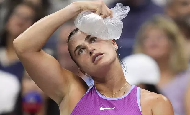 Aryna Sabalenka, of Belarus, cools off with an ice pack between games against Jessica Pegula, of the United States, during the women's singles final of the U.S. Open tennis championships, Saturday, Sept. 7, 2024, in New York. (AP Photo/Julia Nikhinson)