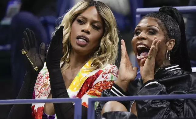 Actress Laverne Cox, left, watches play between Frances Tiafoe, of the United States, and Taylor Fritz, of the United States, during the men's singles semifinal of the U.S. Open tennis championships, Friday, Sept. 6, 2024, in New York. (AP Photo/Frank Franklin II)