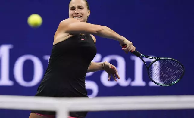 Aryna Sabalenka, of Belarus, returns a shot to Emma Navarro, of the United States, during the women's singles semifinals of the U.S. Open tennis championships, Thursday, Sept. 5, 2024, in New York. (AP Photo/Julia Nikhinson)