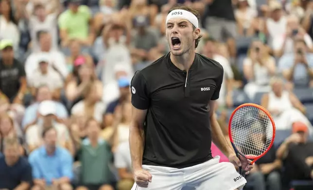 Taylor Fritz, of the United States, reacts after defeating Casper Ruud, of Norway, during the fourth round of the U.S. Open tennis championships, Sunday, Sept. 1, in New York. 2024. (AP Photo/Eduardo Munoz Alvarez)