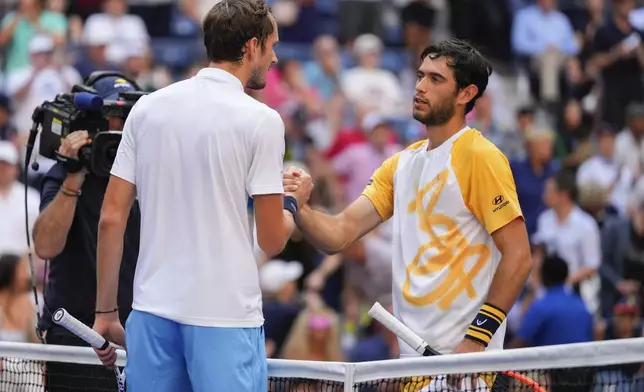 Daniil Medvedev, of Russia, greets Nuno Borges, of Portugal, at the net after winning a match in the fourth round of the U.S. Open tennis championships, Monday, Sept. 2, 2024, in New York. (AP Photo/Kirsty Wigglesworth)