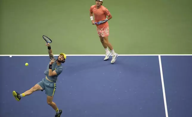 Jordan Thompson, left, and Max Purcell, of Australia, returns a shot to Tim Puetz and Kevin Krawietz, of Germany in the men's doubles final of the U.S. Open tennis championships, Saturday, Sept. 7, 2024, in New York. (AP Photo/Pamela Smith)