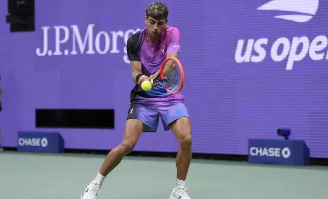 Flavio Cobolli, of Italy, returns a shot to Daniil Medvedev, of Russia, during the third round of the U.S. Open tennis championships, Saturday, Aug. 31, in New York. 2024. (AP Photo/Matt Rourke)