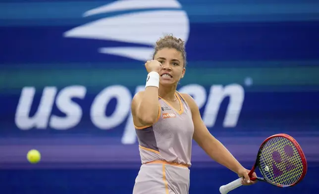 Jasmine Paolini, of Italy, reacts after scoring a point against Yulia Putintseva, of Kazakhstan, of the United States, during the third round of the U.S. Open tennis championships, Saturday, Aug. 31, 2024, in New York. (AP Photo/Kirsty Wigglesworth)