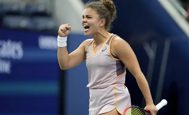 Jasmine Paolini, of Italy, reacts after scoring a point against Yulia Putintseva, of Kazakhstan, of the United States, during the third round of the U.S. Open tennis championships, Saturday, Aug. 31, 2024, in New York. (AP Photo/Kirsty Wigglesworth)