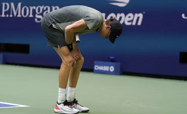 Jannik Sinner, of Italy, holds his wrist after returning a shot to Jack Draper, of Great Britain, during the men's singles semifinals of the U.S. Open tennis championships, Friday, Sept. 6, 2024, in New York. (AP Photo/Kirsty Wigglesworth)