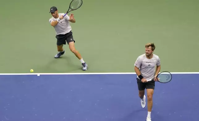 Tim Puetz, left, and Kevin Krawietz, of Germany, return a shot to Jordan Thompson, and Max Purcell, of Australia, during the men's doubles final of the U.S. Open tennis championships, Saturday, Sept. 7, 2024, in New York. (AP Photo/Pamela Smith)