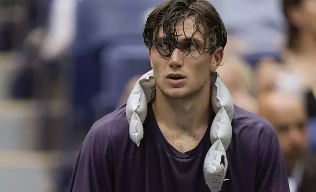 Jack Draper, of Great Britain, cools off during a break between games against Jannik Sinner, of Italy, during the men's singles semifinal of the U.S. Open tennis championships, Friday, Sept. 6, 2024, in New York. (AP Photo/Julia Nikhinson)